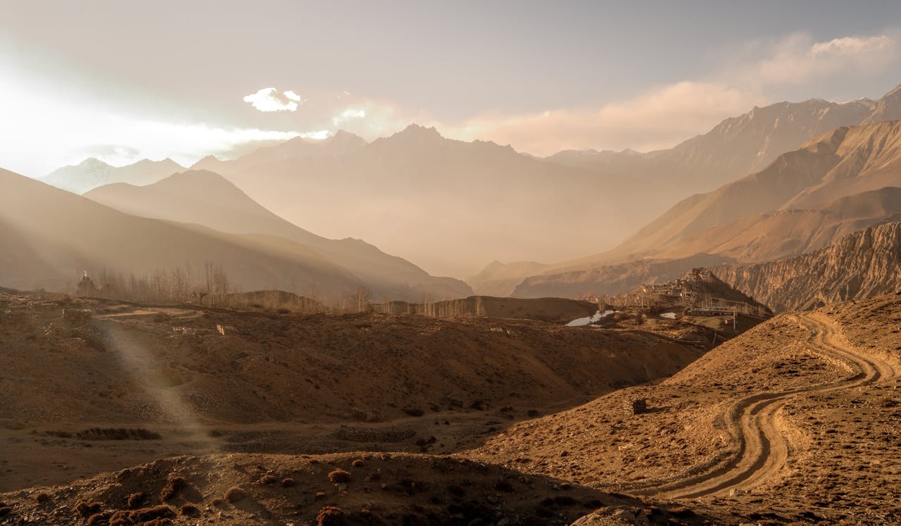Stunning view of Jomsoms mountainous terrain during sunset, showcasing the natural beauty of Nepals landscape.